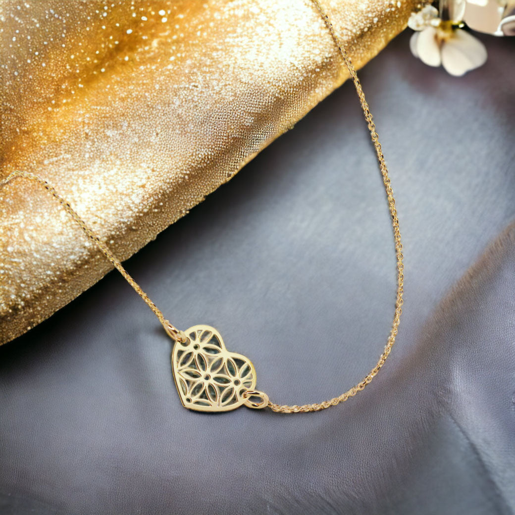 Złota bransoletka z ażurowym sercem 333